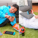 Two men lounge on the cushion in different ways.